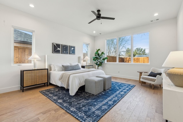 bedroom with ceiling fan and hardwood / wood-style floors