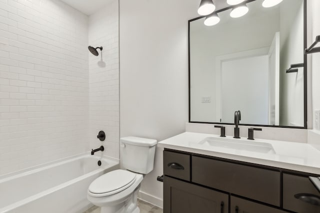 full bathroom featuring toilet, tiled shower / bath combo, and vanity