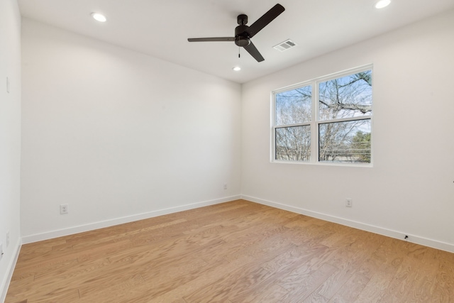 unfurnished room with ceiling fan and light hardwood / wood-style flooring