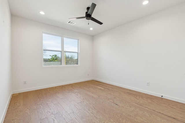 unfurnished room with ceiling fan and light hardwood / wood-style floors