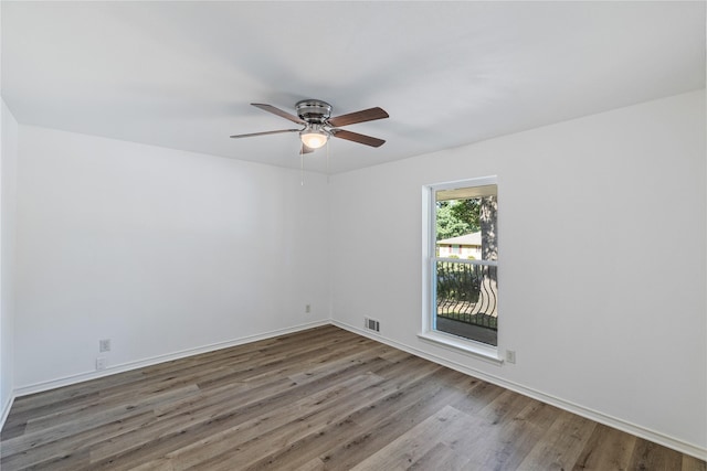 spare room with ceiling fan and hardwood / wood-style floors