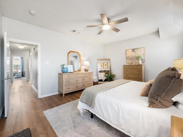 bedroom featuring ceiling fan and dark hardwood / wood-style flooring