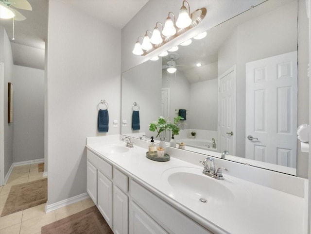 bathroom with ceiling fan, a tub to relax in, tile patterned floors, and vanity