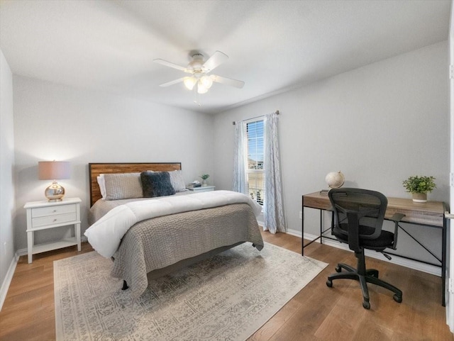 bedroom with ceiling fan and light wood-type flooring