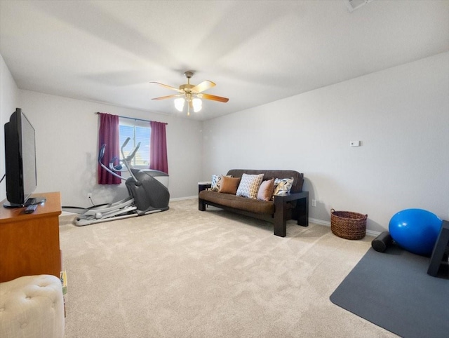 interior space with ceiling fan and light colored carpet