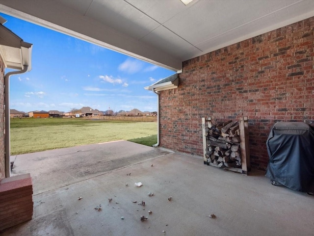 view of patio featuring a grill