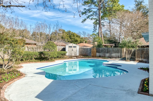 view of swimming pool with a patio and a storage unit