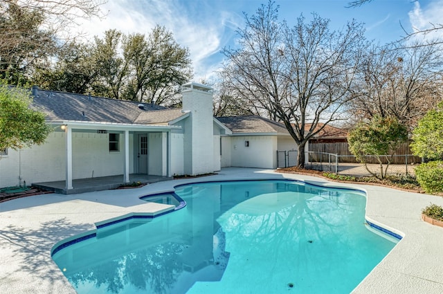 view of pool featuring a patio