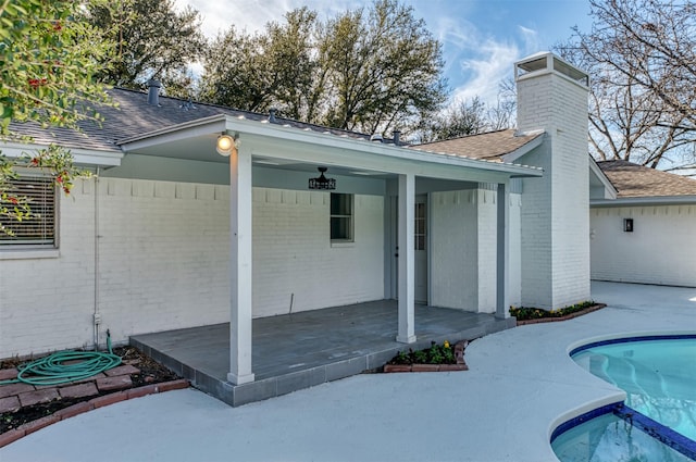 back of house with a patio