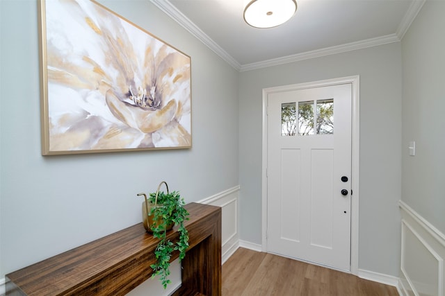 entrance foyer with crown molding and light wood-type flooring