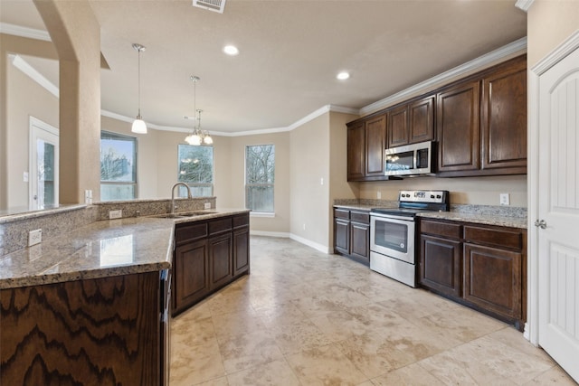 kitchen featuring pendant lighting, dark brown cabinetry, stainless steel appliances, a chandelier, and crown molding