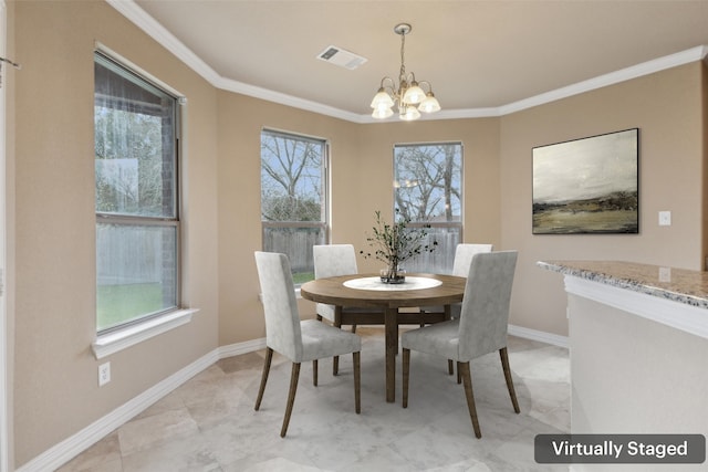 dining space with crown molding and a notable chandelier