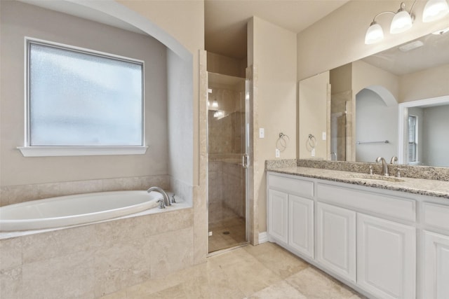 bathroom with shower with separate bathtub and vanity