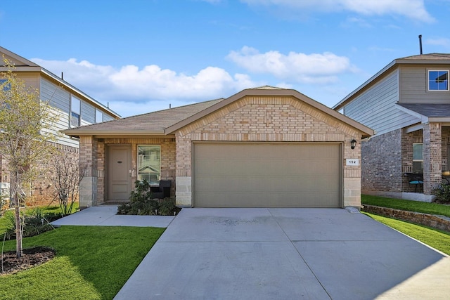 view of front of home with a garage and a front yard