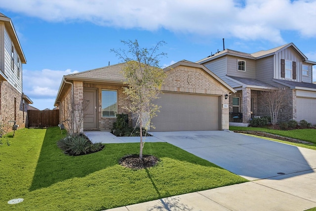 view of front of property featuring a garage and a front yard