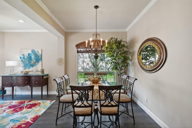 dining area featuring crown molding, dark hardwood / wood-style flooring, and a chandelier