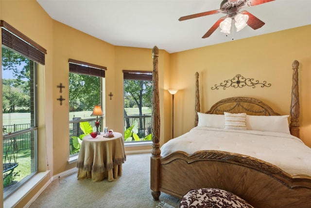 carpeted bedroom featuring access to outside