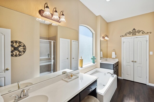 bathroom with vanity, plus walk in shower, and hardwood / wood-style floors