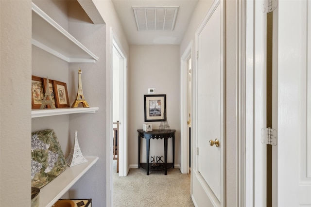 hallway featuring light carpet