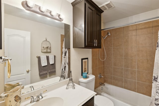 full bathroom featuring shower / bath combination with curtain, vanity, and toilet