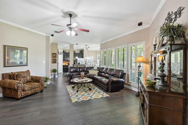 living room with dark hardwood / wood-style flooring, ornamental molding, and ceiling fan