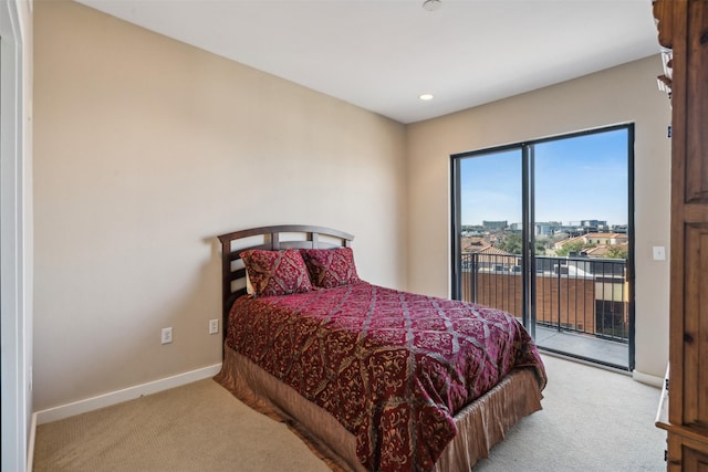 bedroom with light carpet and access to exterior