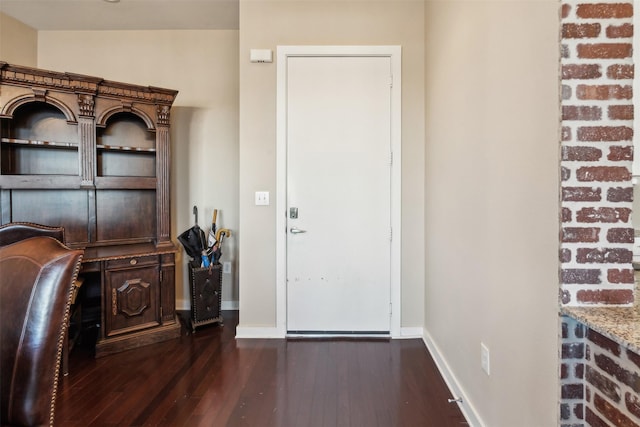 foyer entrance featuring dark hardwood / wood-style floors