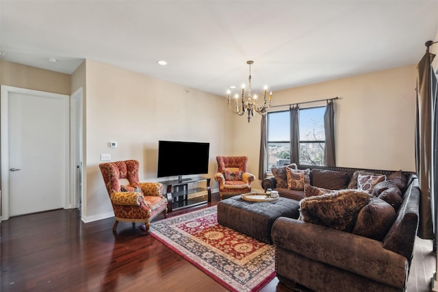 living room featuring dark wood-type flooring and a notable chandelier