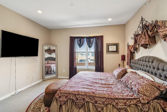 bedroom featuring light colored carpet