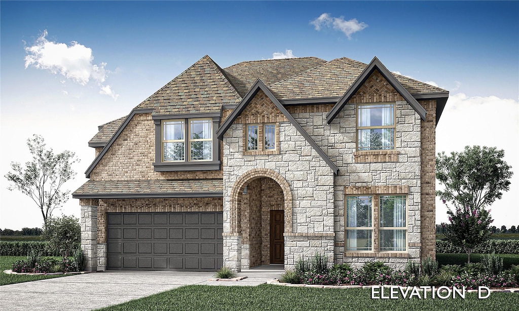 tudor-style house featuring a garage