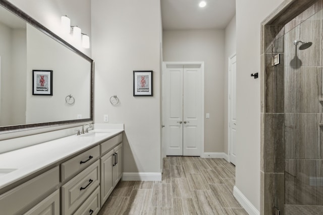 bathroom featuring vanity and a tile shower