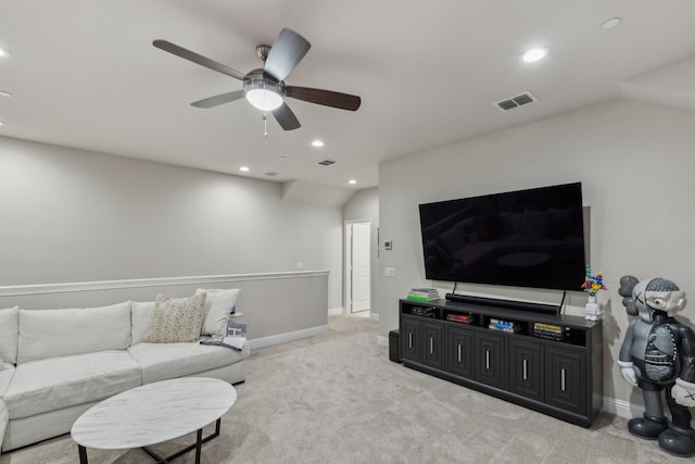 living room with vaulted ceiling, ceiling fan, and light colored carpet