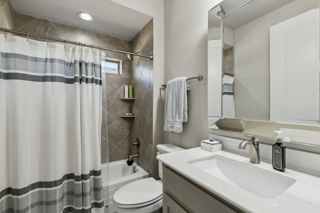 full bathroom featuring toilet, vanity, and shower / bath combo with shower curtain