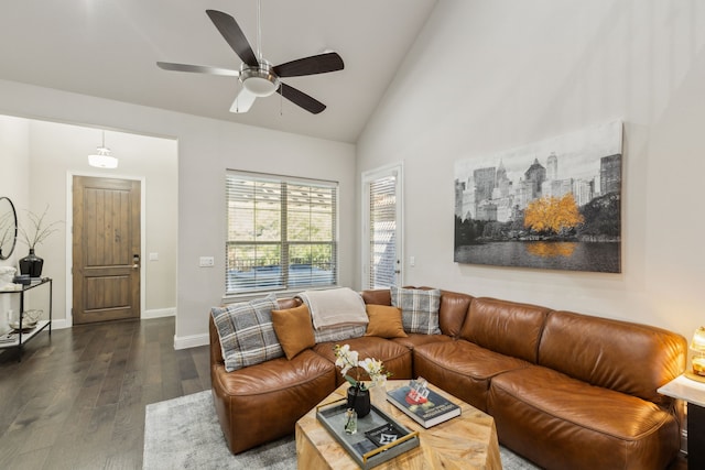 living room with dark wood-type flooring, high vaulted ceiling, and ceiling fan