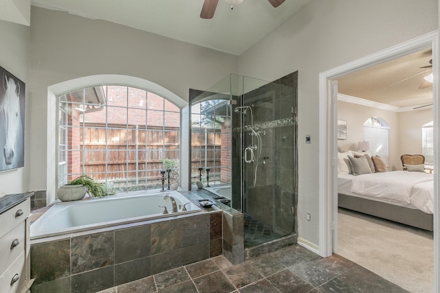 bathroom featuring ceiling fan, a healthy amount of sunlight, and independent shower and bath