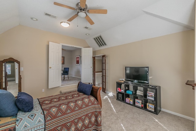 bedroom featuring ceiling fan, lofted ceiling, and light colored carpet