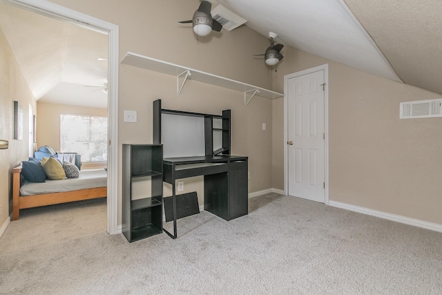 interior space featuring light carpet and ceiling fan