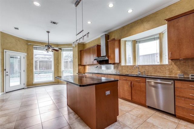 kitchen with dishwasher, a center island, track lighting, decorative light fixtures, and sink