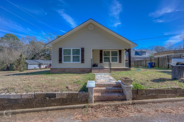 bungalow-style home with a front yard and a porch