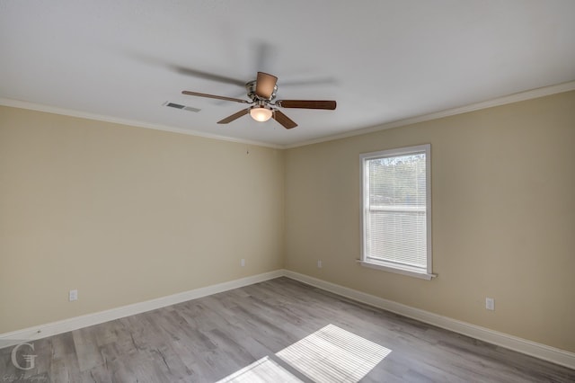 unfurnished room with ceiling fan, crown molding, and light hardwood / wood-style floors