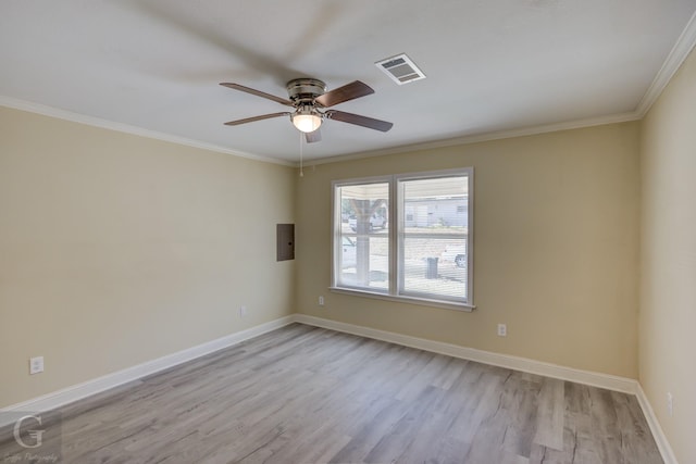 unfurnished room featuring ceiling fan, ornamental molding, light hardwood / wood-style flooring, and electric panel