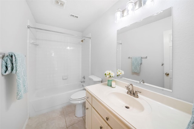 full bathroom with toilet, tiled shower / bath combo, tile patterned floors, and vanity