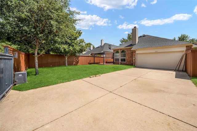 view of front of property with a front lawn and a garage