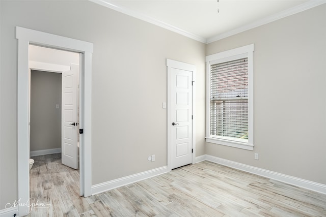 unfurnished bedroom featuring light hardwood / wood-style flooring and ornamental molding