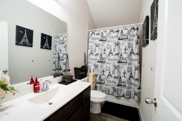 bathroom with vanity, toilet, wood finished floors, and shower / bath combo with shower curtain