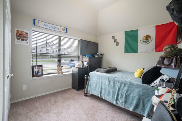 bedroom with baseboards, carpet flooring, and vaulted ceiling