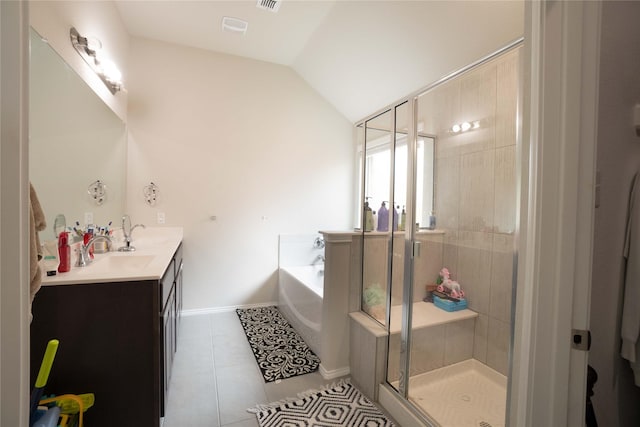 full bathroom with a stall shower, tile patterned flooring, lofted ceiling, a bath, and vanity