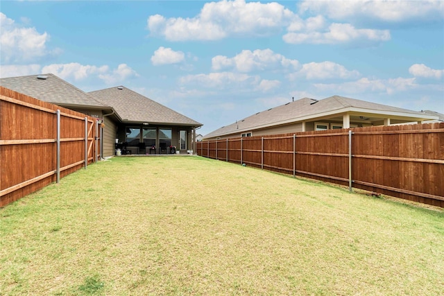 view of yard featuring a fenced backyard