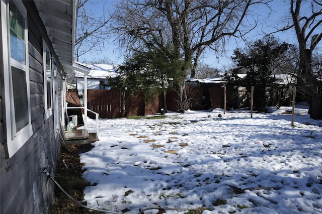 view of yard layered in snow