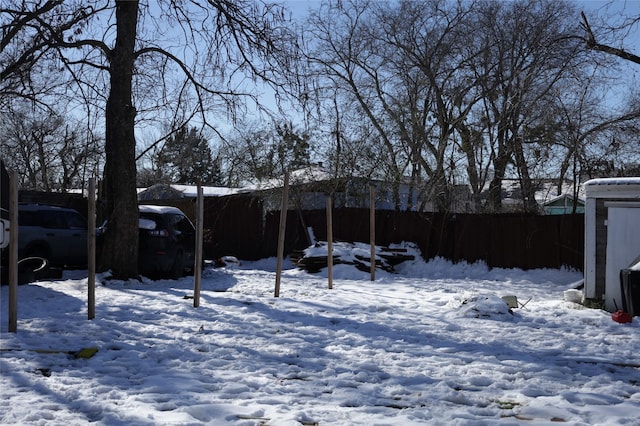 view of yard layered in snow